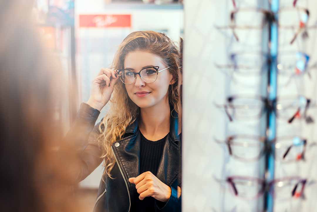 Woman trying on new eyeglasses
